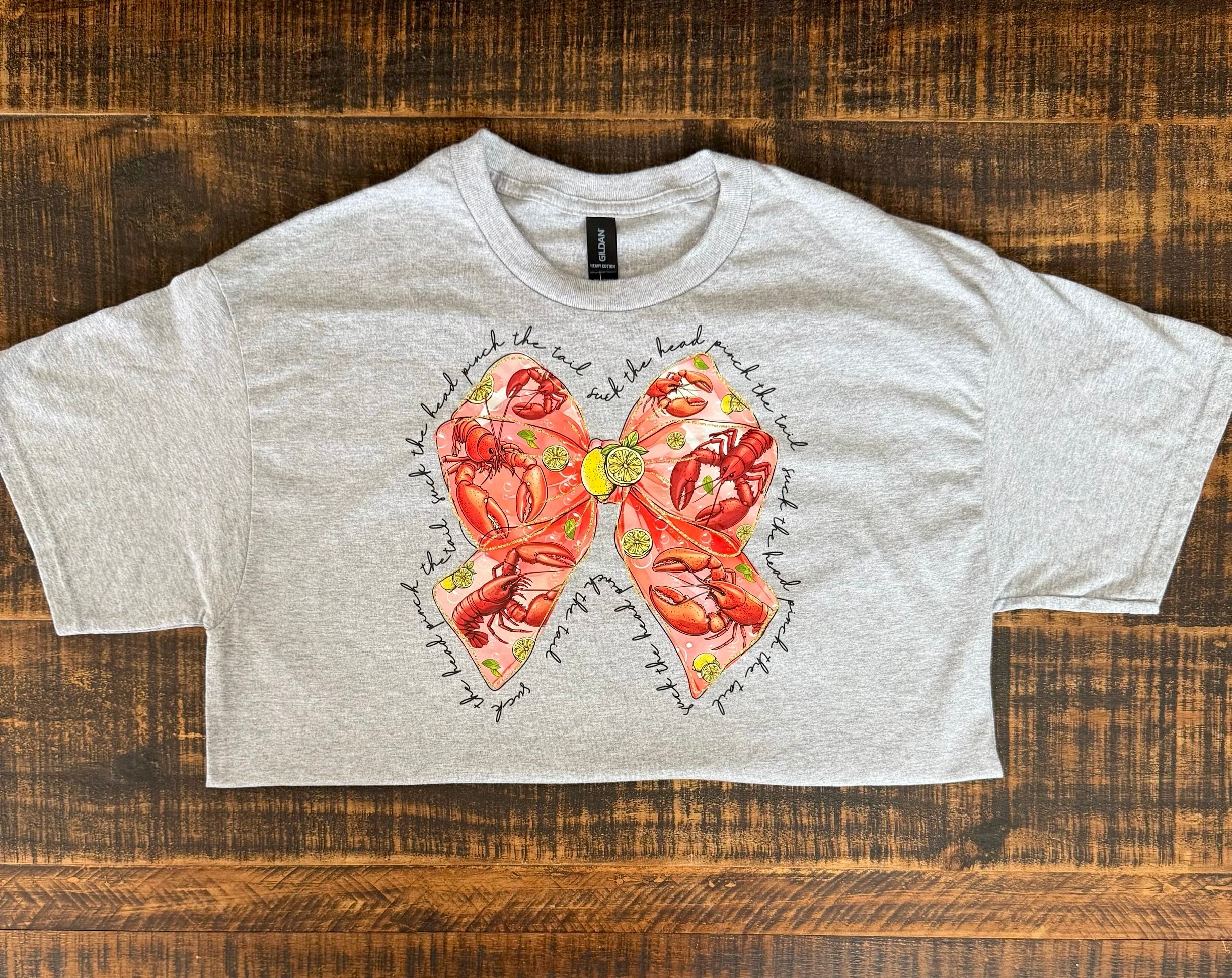 “Suck The Head Pinch The Tail” Bow Tee